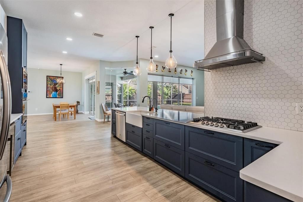 Dining room, Interior, Kitchen, Pendant Lights, Recessed Lighting, Stainless Steel Appliances, Wood Texture Flooring