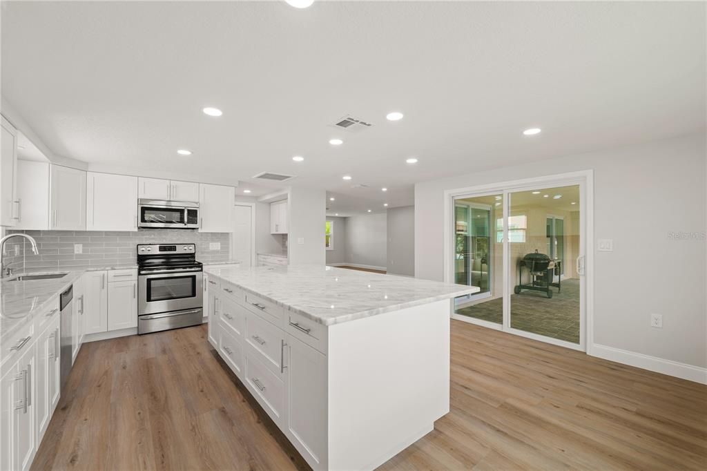 Interior, Kitchen, Recessed Lighting, Stainless Steel Appliances, Wood Texture Flooring
