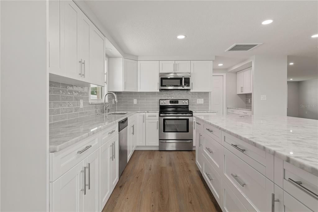 Interior, Kitchen, Recessed Lighting, Stainless Steel Appliances, Wood Texture Flooring