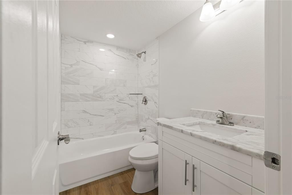 Bathroom, Interior, Marble Walls, Recessed Lighting, Wood Texture Flooring