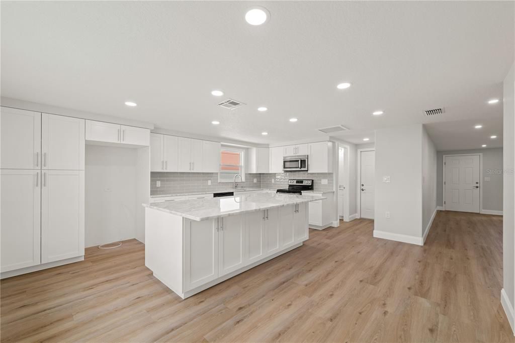 Interior, Kitchen, Recessed Lighting, Stainless Steel Appliances, Wood Texture Flooring