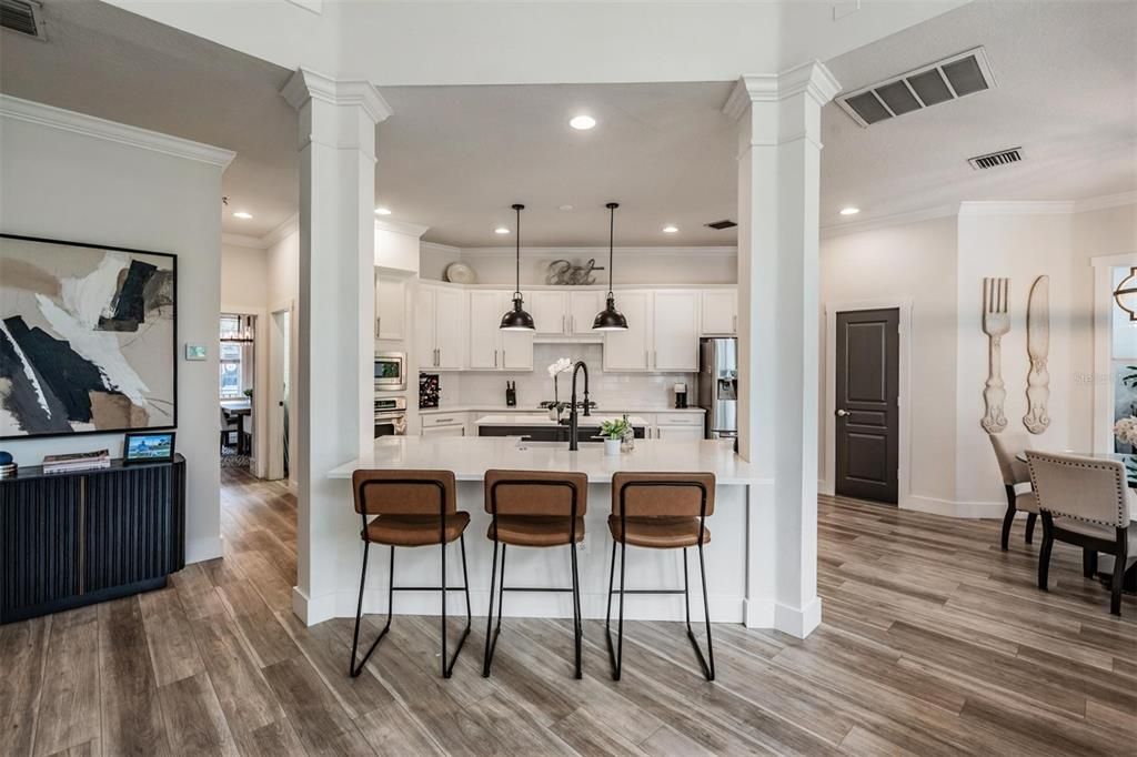 Dining room, Interior, Kitchen, Pendant Lights, Recessed Lighting, Stainless Steel Appliances, Wood Texture Flooring