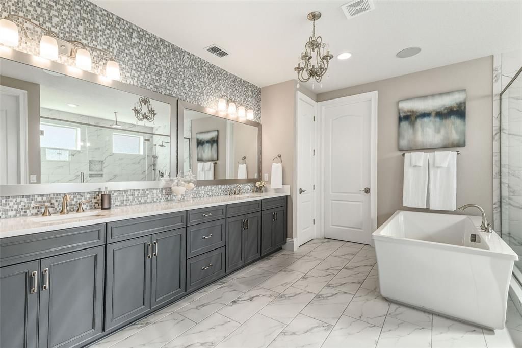 Bathroom, Chandelier, Dual Sink Vanities, Free Standing Baths, Interior, Marble, Marble Walls, Recessed Lighting