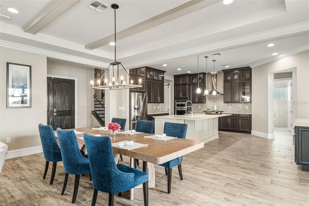 Chandelier, Dining room, Interior, Kitchen, Pendant Lights, Recessed Lighting, Stainless Steel Appliances, Wood Texture Flooring