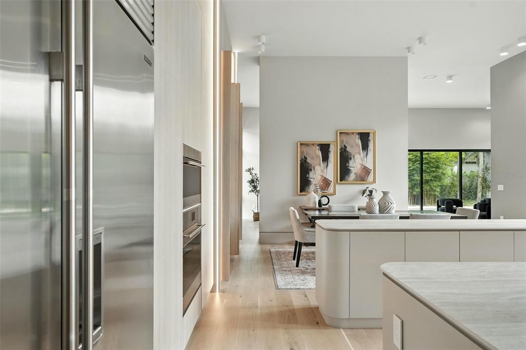 Dining room, Interior, Kitchen, Living room, Recessed Lighting, Stainless Steel Appliances, Wood Texture Flooring