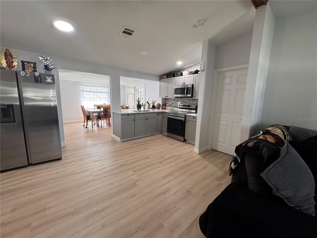 Dining room, Interior, Kitchen, Recessed Lighting, Stainless Steel Appliances, Wood Texture Flooring