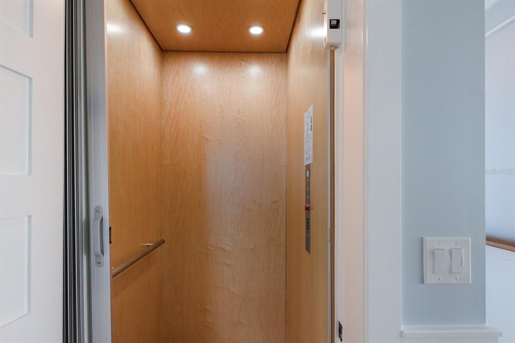 Elevator, Interior, Recessed Lighting, Wooden Ceilings, Wooden Walls
