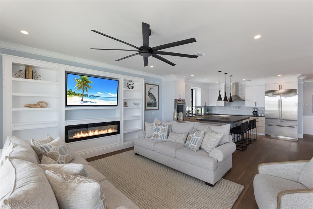 Fireplace, Interior, Kitchen, Living room, Pendant Lights, Recessed Lighting, Stainless Steel Appliances, Wood Texture Flooring