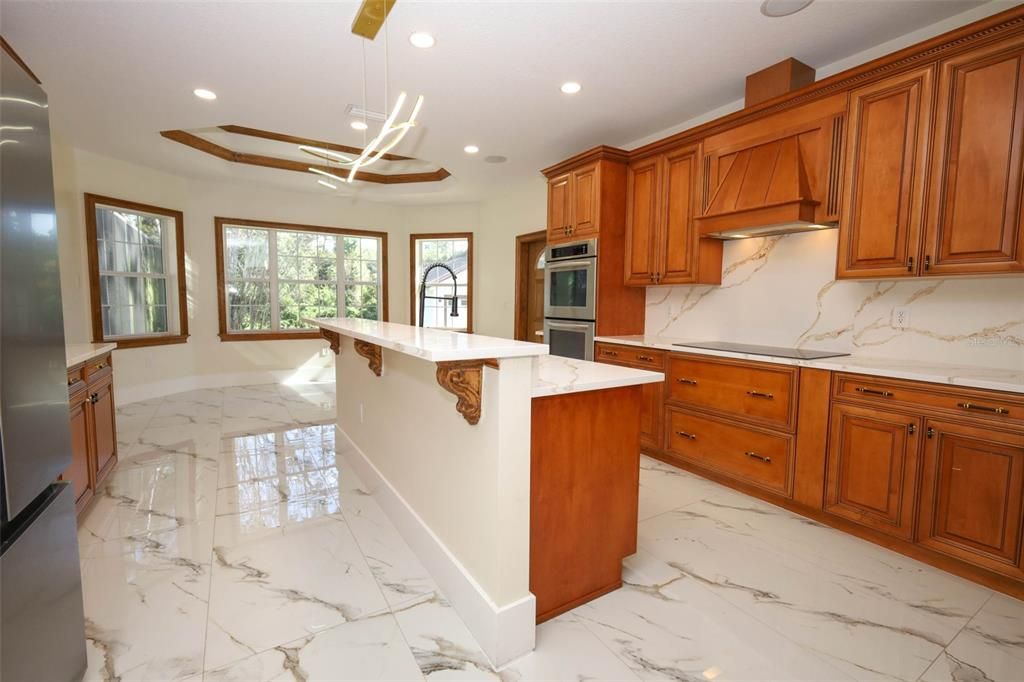 Interior, Kitchen, Marble, Marble Walls, Pendant Lights, Recessed Lighting, Stainless Steel Appliances