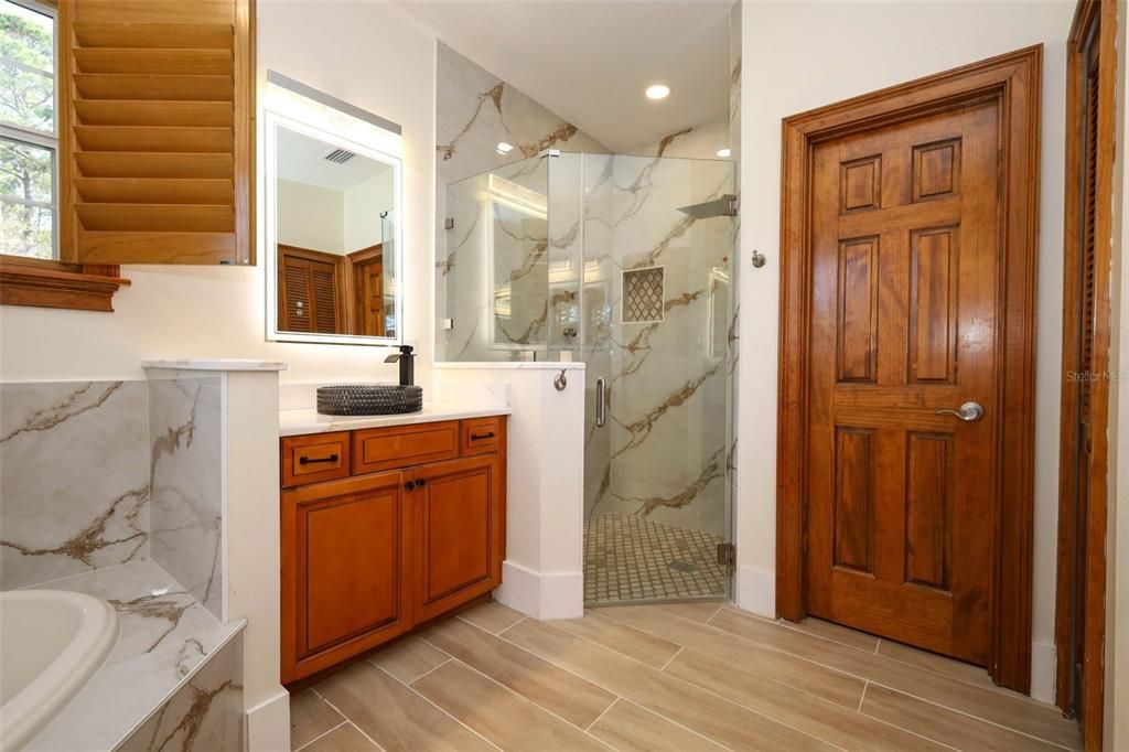 Bathroom, Glass Shower, Interior, Marble Walls, Recessed Lighting, Wood Texture Flooring