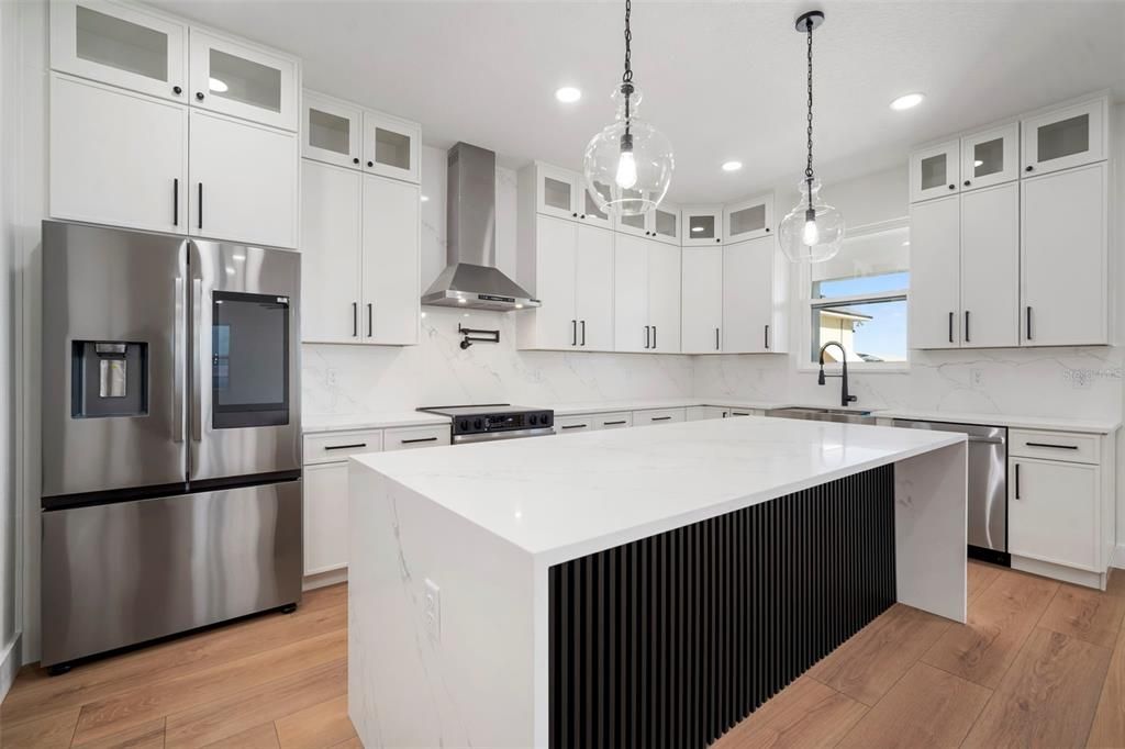 Interior, Kitchen, Marble Walls, Pendant Lights, Recessed Lighting, Stainless Steel Appliances, Wood Texture Flooring