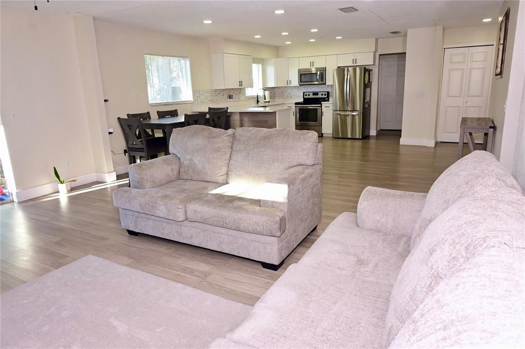Dining room, Interior, Kitchen, Living room, Recessed Lighting, Stainless Steel Appliances, Wood Texture Flooring