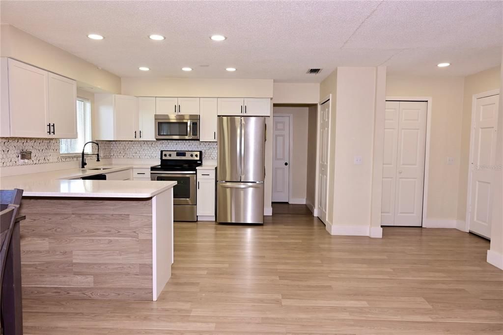 Interior, Kitchen, Recessed Lighting, Stainless Steel Appliances, Wood Texture Flooring