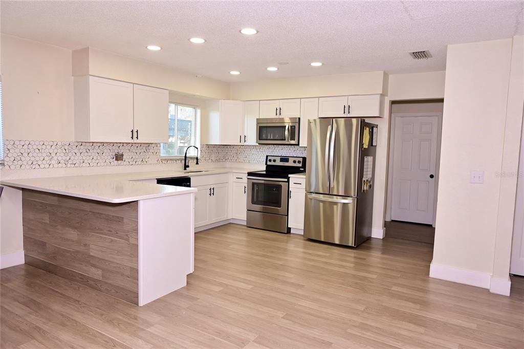 Interior, Kitchen, Recessed Lighting, Stainless Steel Appliances, Wood Texture Flooring