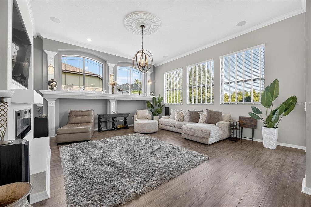 Chandelier, Fireplace, Interior, Living room, Pendant Lights, Recessed Lighting, Wood Texture Flooring