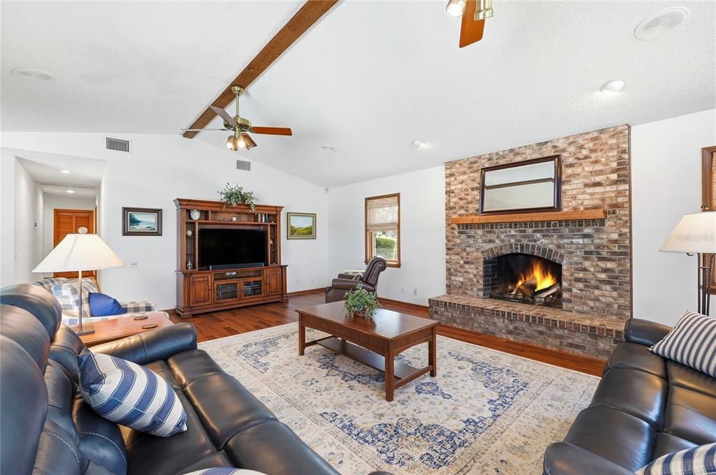 Fireplace, Interior, Living room, Recessed Lighting, Stone Walls, Wood Texture Flooring