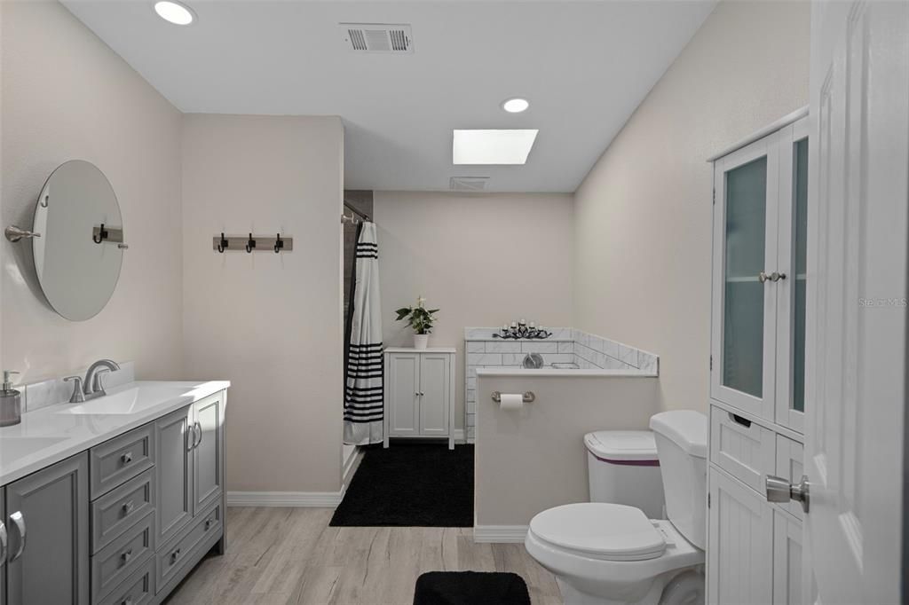 Bathroom, Dual Sink Vanities, Interior, Recessed Lighting, Wood Texture Flooring