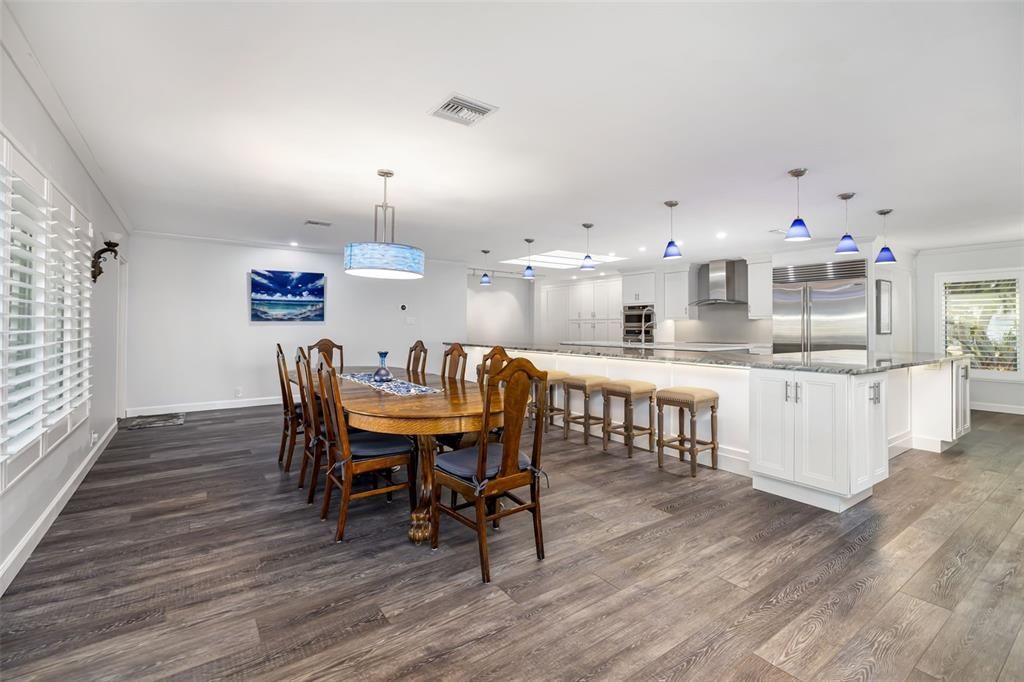 Dining room, Interior, Kitchen, Pendant Lights, Recessed Lighting, Stainless Steel Appliances, Wood Texture Flooring