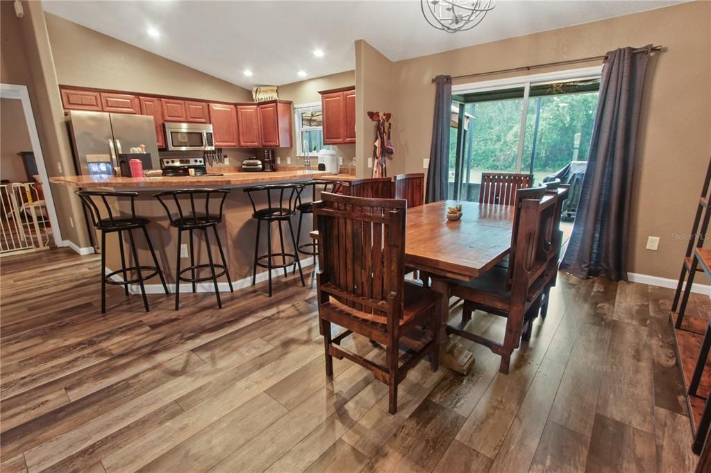 Dining room, Interior, Kitchen, Recessed Lighting, Stainless Steel Appliances, Wood Texture Flooring