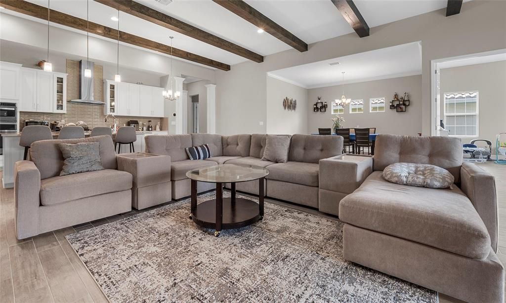 Chandelier, Dining room, Interior, Kitchen, Living room, Pendant Lights, Recessed Lighting, Wooden Beams, Wood Texture Flooring