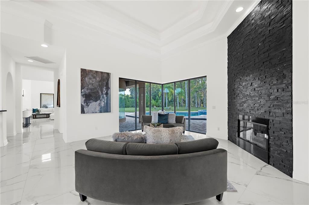 Fireplace, Interior, Living room, Marble, Recessed Lighting, Stone Walls