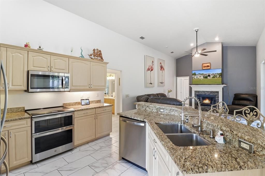 Fireplace, Interior, Kitchen, Marble, Recessed Lighting, Stainless Steel Appliances