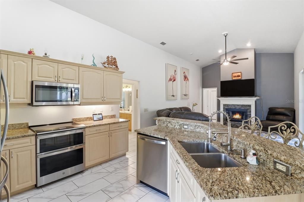 Fireplace, Interior, Kitchen, Marble, Recessed Lighting, Stainless Steel Appliances