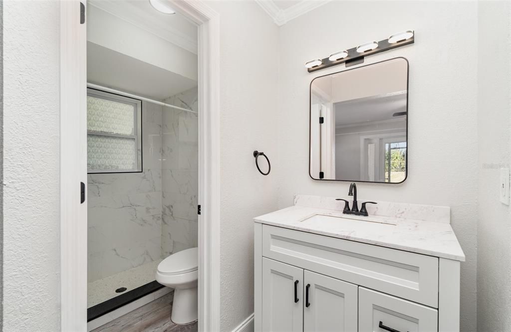 Bathroom, Glass Shower, Interior, Marble Walls, Wood Texture Flooring