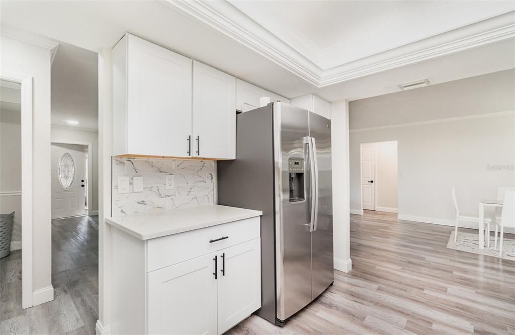 Interior, Kitchen, Marble Walls, Recessed Lighting, Stainless Steel Appliances, Wood Texture Flooring