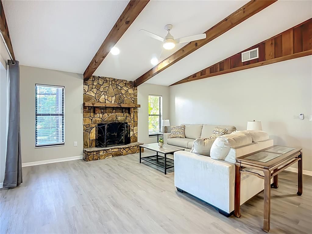 Fireplace, Interior, Living room, Recessed Lighting, Stone Walls, Wooden Beams, Wood Texture Flooring