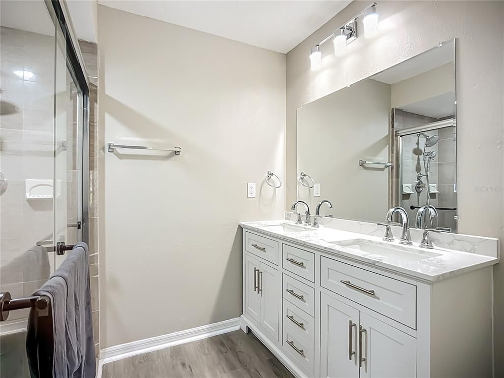 Bathroom, Dual Sink Vanities, Glass Shower, Interior, Wood Texture Flooring