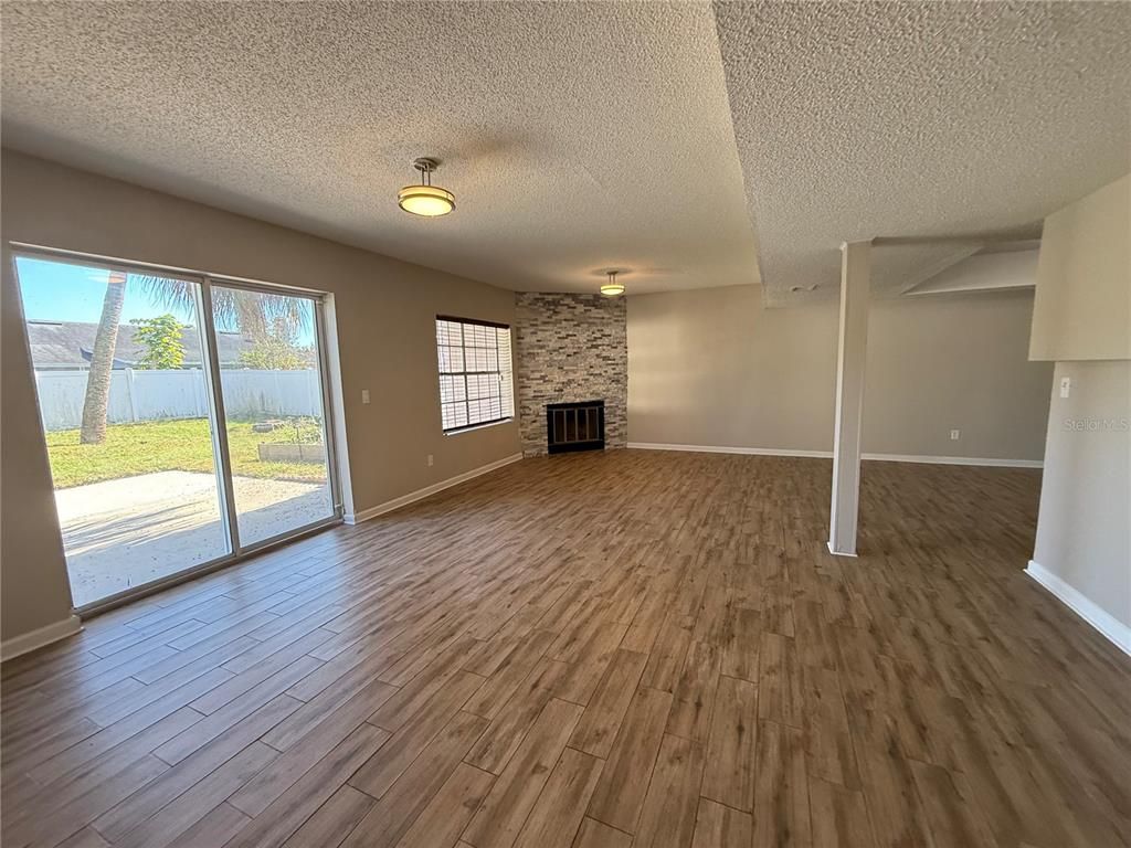 Empty room, Fireplace, Interior, Stone Walls, Wood Texture Flooring