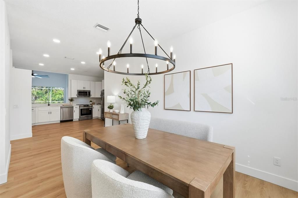 Chandelier, Dining room, Interior, Kitchen, Recessed Lighting, Stainless Steel Appliances, Wood Texture Flooring