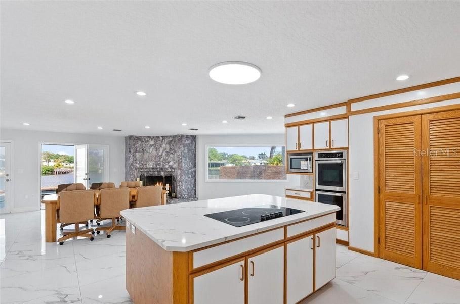 Dining room, Fireplace, Interior, Kitchen, Marble, Recessed Lighting, Stainless Steel Appliances