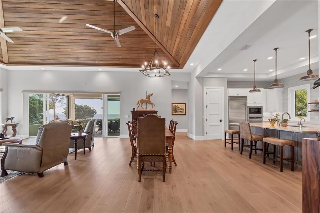 Chandelier, Dining room, Interior, Kitchen, Pendant Lights, Recessed Lighting, Stainless Steel Appliances, Wooden Ceilings, Wood Texture Flooring