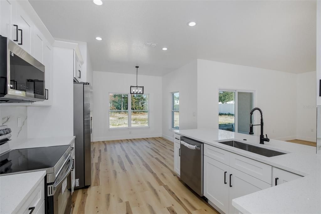 Interior, Kitchen, Pendant Lights, Recessed Lighting, Stainless Steel Appliances, Wood Texture Flooring