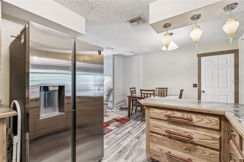 Dining room, Interior, Kitchen, Pendant Lights, Stainless Steel Appliances, Wood Texture Flooring