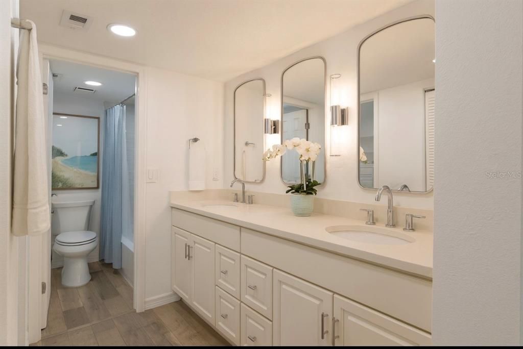 Bathroom, Dual Sink Vanities, Interior, Recessed Lighting, Wood Texture Flooring
