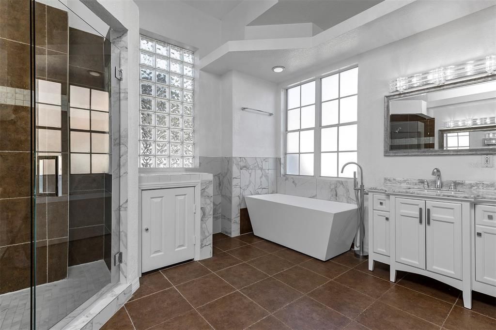 Bathroom, Dual Sink Vanities, Free Standing Baths, Glass Shower, Interior, Marble Walls, Recessed Lighting