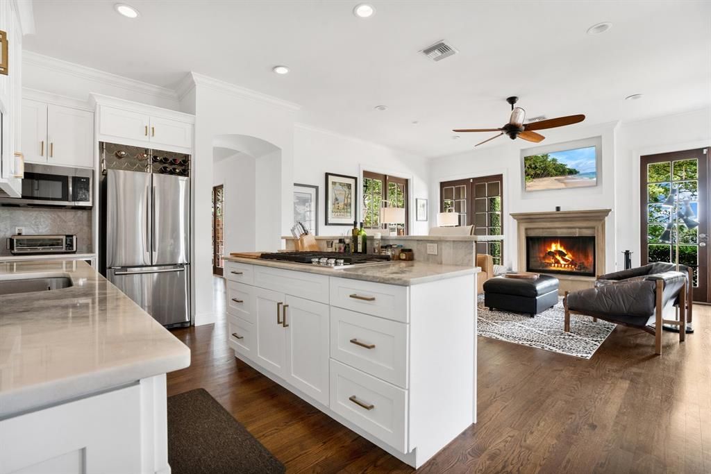 Fireplace, Interior, Kitchen, Living room, Recessed Lighting, Stainless Steel Appliances, Wood Texture Flooring