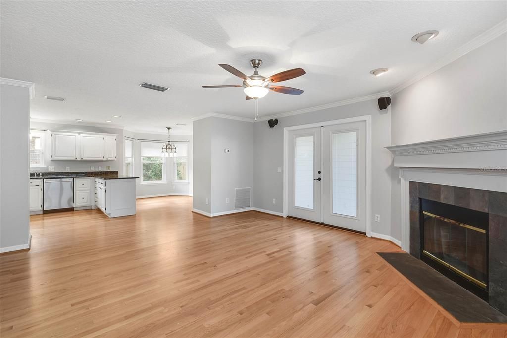 Empty room, Fireplace, Interior, Kitchen, Pendant Lights, Recessed Lighting, Wood Texture Flooring