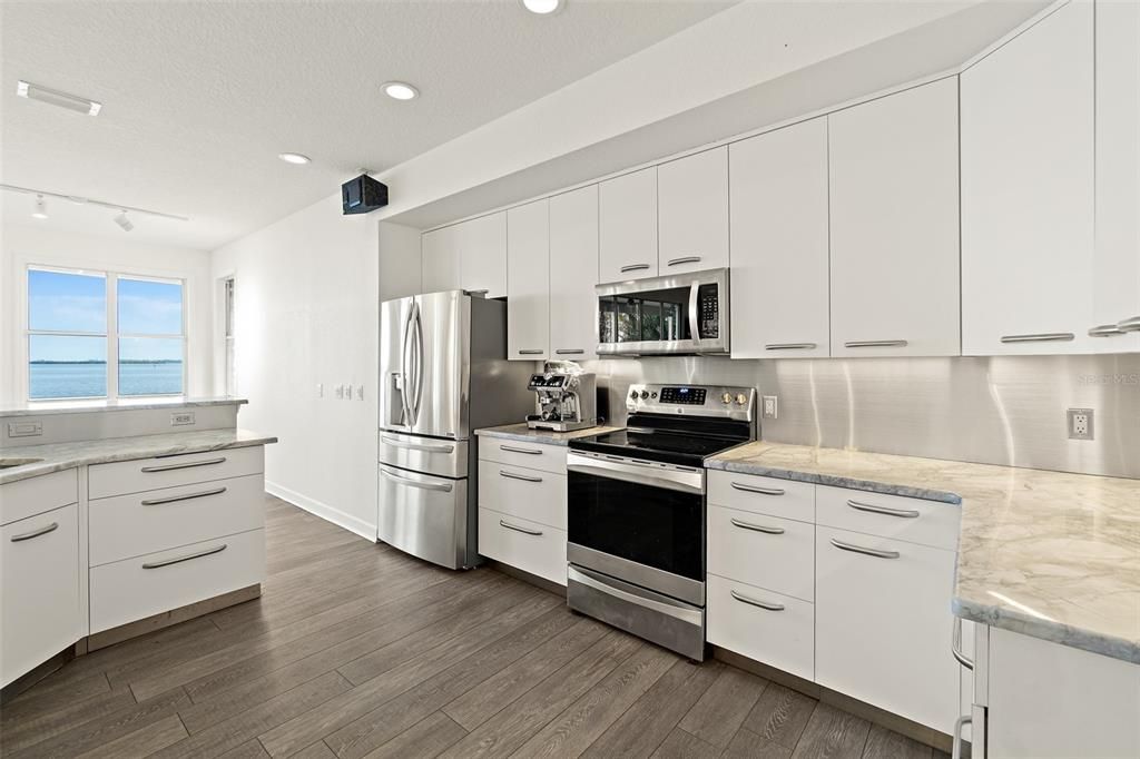 Interior, Kitchen, Recessed Lighting, Stainless Steel Appliances, Water, Wood Texture Flooring