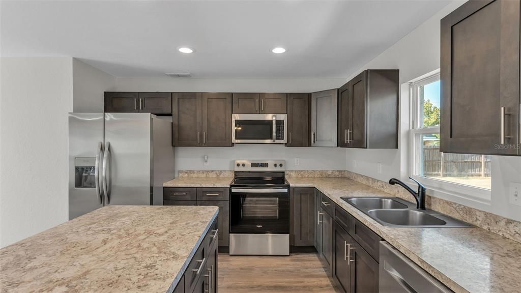 Interior, Kitchen, Recessed Lighting, Stainless Steel Appliances, Wood Texture Flooring