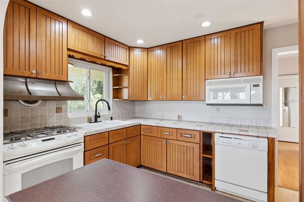 Interior, Kitchen, Recessed Lighting, Tile Countertops, Wood Texture Flooring