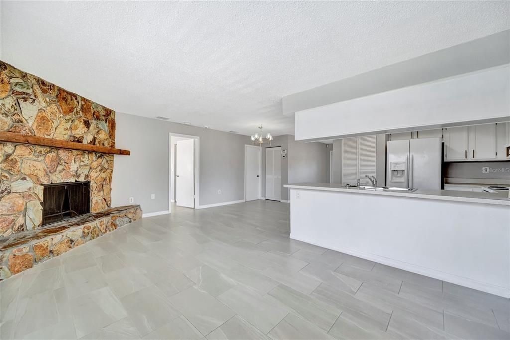 Chandelier, Empty room, Fireplace, Interior, Kitchen, Stainless Steel Appliances