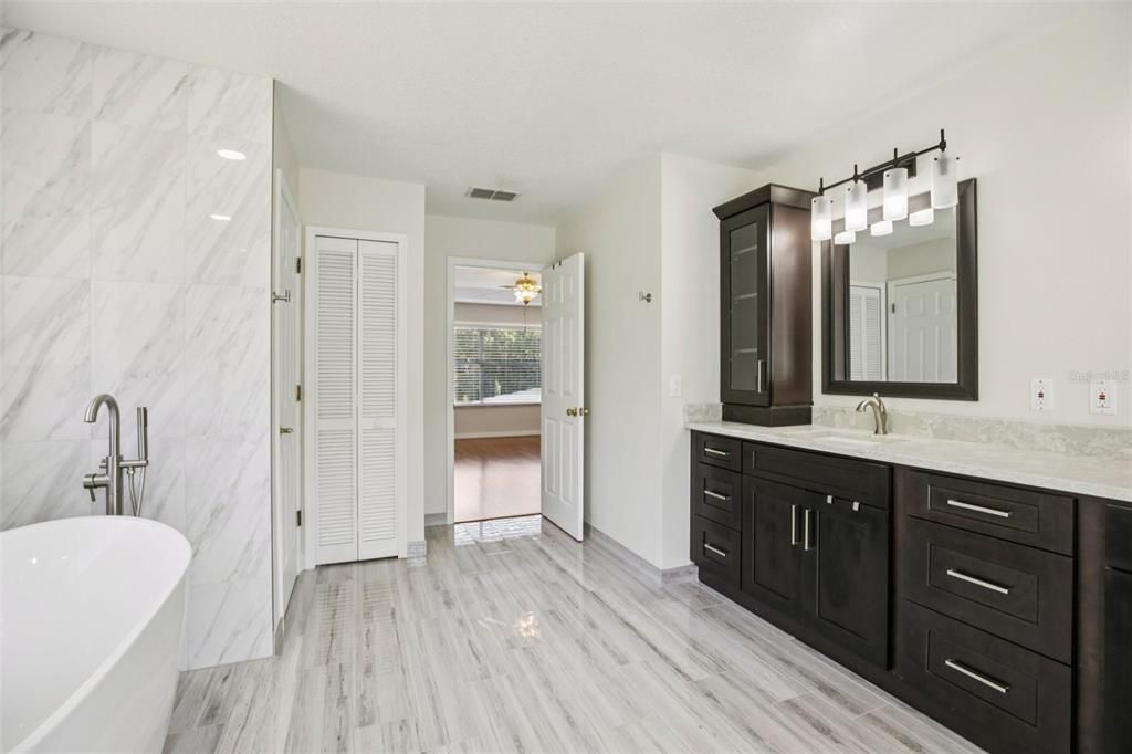 Bathroom, Dual Sink Vanities, Free Standing Baths, Interior, Marble Walls, Wood Texture Flooring