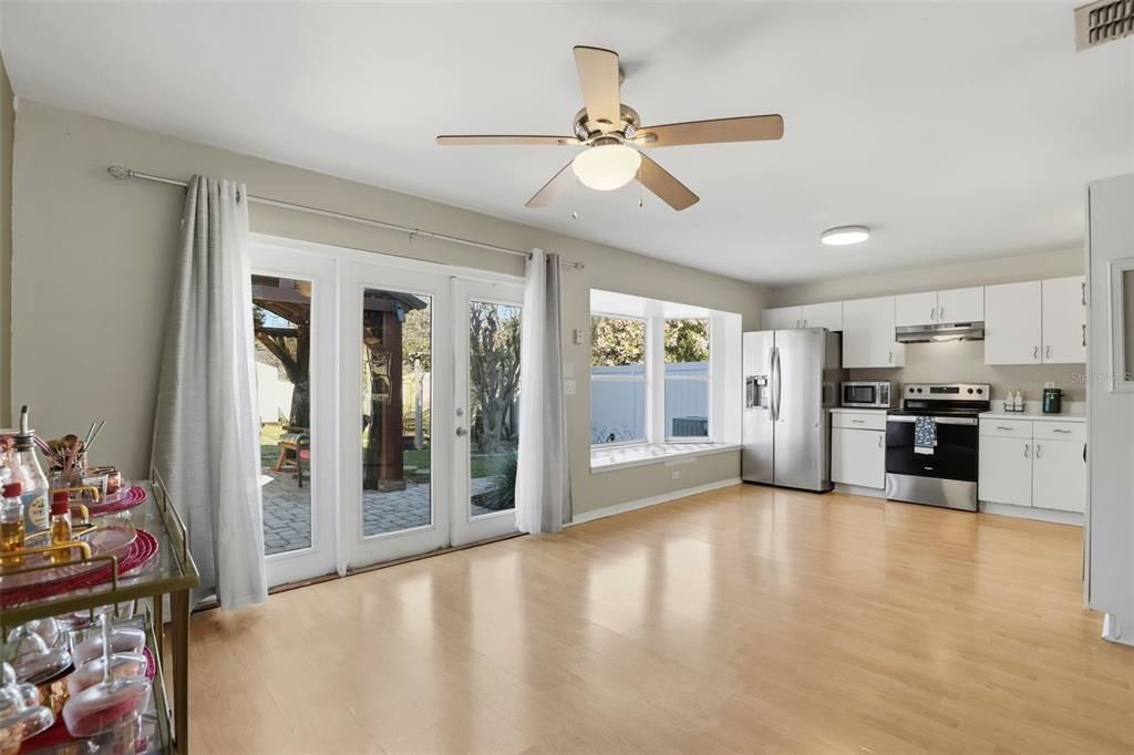 Empty room, Interior, Kitchen, Recessed Lighting, Stainless Steel Appliances, Wood Texture Flooring