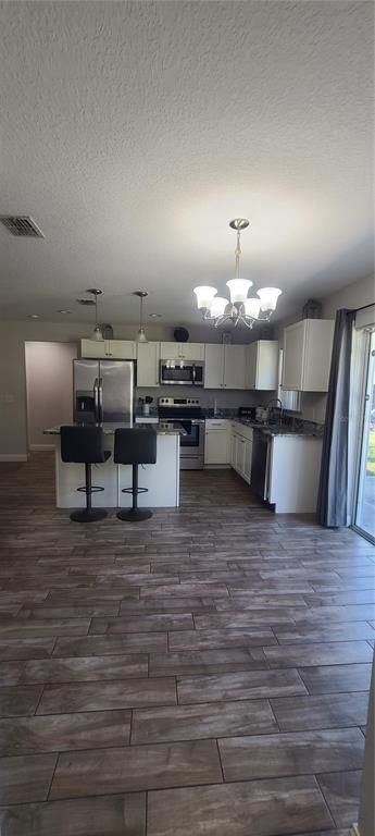 Chandelier, Interior, Kitchen, Stainless Steel Appliances, Wood Texture Flooring