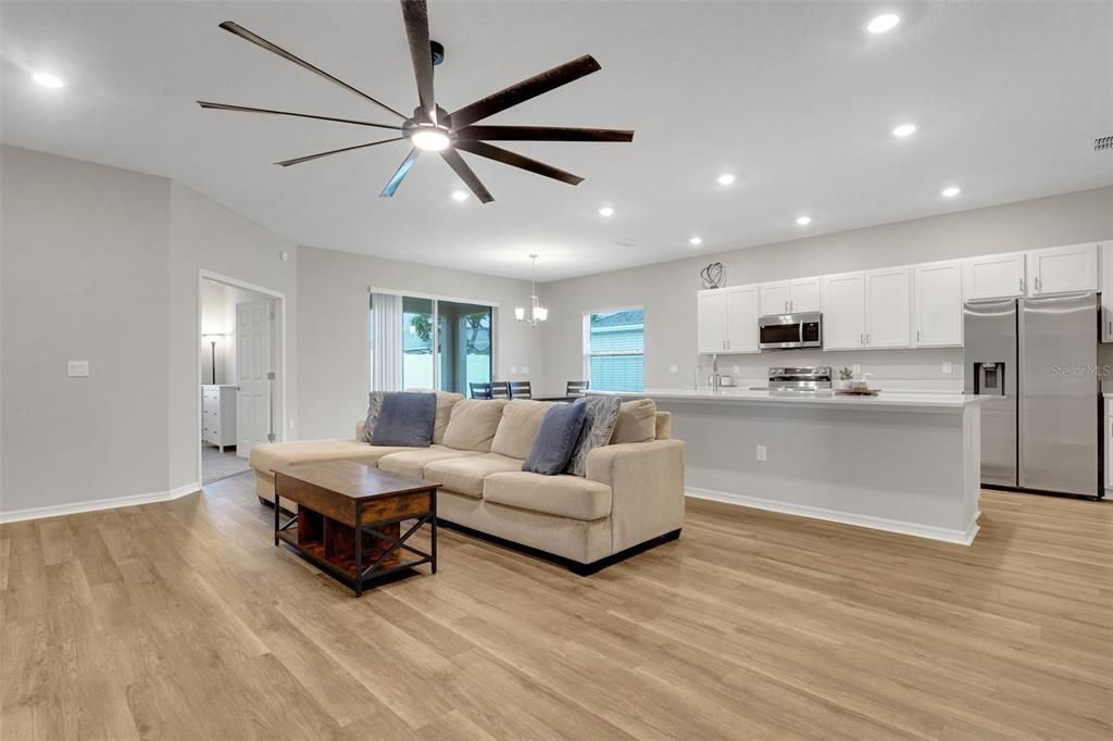 Chandelier, Interior, Kitchen, Living room, Pendant Lights, Recessed Lighting, Stainless Steel Appliances, Wood Texture Flooring