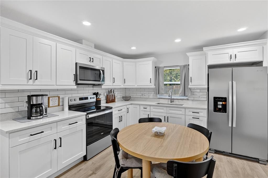Dining room, Interior, Kitchen, Recessed Lighting, Stainless Steel Appliances, Wood Texture Flooring